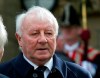 FILE - In this file photo dated Thursday Feb. 27, 2014, former Manchester United manager and Preston North End player Tommy Docherty is seen before a funeral service for the late Sir Tom Finney at Preston Minster, Preston, England. According to a family statement, Tommy Docherty, known as 'The Doc', who managed Manchester United and Scotland, has died Thursday Dec. 31, 2020, aged 92. (AP Photo/Jon Super, FILE)