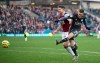 Leicester City's Jamie Vardy, right, has an unsuccessful shot on goal under pressure form Burnley's James Tarkowski, during their English Premier League soccer match at Turf Moor in Burnley, England, Sunday Jan. 19, 2020. (Nick Potts/PA via AP)