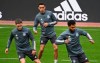 German national soccer team players, from left, Florian Wirtz, Jamal Musiala and Serge Gnabry go through their paces during a team practice session ahead of their upcoming World Cup qualifier match against Iceland, at Merkur-Spiel-Arena in Duesseldorf, Germany, Tuesday March 23, 2021. (Federico Gambarini/dpa via AP)