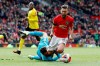 Manchester United's Bruno Fernandes is brought down in the penalty area by Watford goalkeeper Ben Foster, during their English Premier League soccer match at Old Trafford in Manchester, England, Sunday Feb. 23, 2020. Fernandes went on to score from the penalty spot. (Martin Rickett/PA via AP)