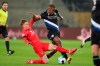 Bielefeld's Sergio Cordova, right, battles with Berlin's Maximilian Mittelstadt during their German Bundesliga soccer match at Schuco Arena in Bielefeld, Germany, Sunday Jan. 10, 2021. (Friso Gentsch/dpa via AP)