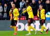Watford's Roberto Pereyra, left, celebrates scoring his side's second goal of the game against Everton during the English Premier League soccer match at Vicarage Road in Watford, England, Saturday Feb. 1, 2020. (Jonathan Brady/PA via AP)