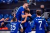 Schalke team members with from left: Amine Harit, Schalke's Sead Kolasinac, goal scorer Matthew Hoppe, coaching staff Naldo, and Mark Uth celebrate their second goal goal against Hoffenheim, during their German Bundesliga FC Schalke 04 - 1899 Hoffenheim soccer match at Veltins Arena in Gelsenkirchen, Germany, Saturday Jan. 9, 2021. (Guido Kirchner/dpa via AP)