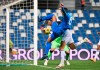 Rogerio of Sassuolo team, near camera, competes for the ball in goalmouth action with Jens Stryger Larsen of Udinese, during their Italian Serie A soccer match between Sassuolo and Udinese at the Mapei Stadium in Reggio Emilia, Italy, Friday, Nov. 6, 2020. (Massimo Paolone/LaPresse via AP)