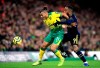Norwich City's Onel Hernandez, left, and Arsenal's Alexandre Lacazette in action during their English Premier League soccer match at Carrow Road in Norwich, England, Sunday Dec. 1, 2019. (Adam Davy/PA via AP)
