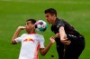 Leipzig's Tyler Adams, left, and Stuttgart's Marc Oliver Kempf in action during their German Bundesliga soccer match at the Red Bull Arena in Leipzig, Germany, Sunday April 25, 2021. (Odd Andersen/Pool via AP)