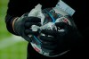 Staff members clean and disinfect the match balls after the the German first division Bundesliga soccer match, with Union Berlin facing FSV Mainz 05, being played without spectators because of the coronavirus, in Berlin, Germany, Wednesday May 27, 2020. (Odd Andersen / Pool via AP)