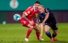 Berlin's Christopher Trimmel, left, shases after the ball against SC Paderborn's Sven Michel, during their German Bundesliga soccer match in Berlin, Germany, Tuesday Dec. 22, 2020. (Andreas Gora/dpa via AP)