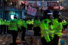 Police secure the area after fans protested against Arsenal owner Stan Kroenke before their English Premier League match against Everton, at the Emirates Stadium in London, Friday April 23, 2021. The fans want owner Stan Kroenke to leave the club over its bid to join the failed Super League. (Kirsty O'Connor/PA via AP)