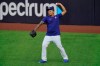 Los Angeles Dodgers starting pitcher Julio Urias warms up during batting practice before Game 1 of the baseball World Series against the Tampa Bay Rays Tuesday, Oct. 20, 2020, in Arlington, Texas. (AP Photo/Sue Ogrocki)