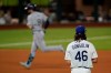 Tampa Bay Rays' Brandon Lowe rounds the bases after a home run off Los Angeles Dodgers starting pitcher Tony Gonsolin during the first inning in Game 2 of the baseball World Series Wednesday, Oct. 21, 2020, in Arlington, Texas. (AP Photo/Eric Gay)