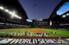 The Los Angeles Dodgers line up during during the national anthem and a fly over before Game 1 of the baseball World Series against the Tampa Bay Rays Tuesday, Oct. 20, 2020, in Arlington, Texas. (AP Photo/Eric Gay)