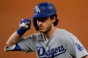 Los Angeles Dodgers' Cody Bellinger celebrates his RBI-single against the Tampa Bay Rays during the first inning in Game 5 of the baseball World Series Sunday, Oct. 25, 2020, in Arlington, Texas. (AP Photo/Eric Gay)