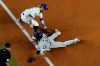 Tampa Bay Rays' Manuel Margot is safe at third past Los Angeles Dodgers third baseman Justin Turner on a ball hit by Joey Wendle during the second inning in Game 2 of the baseball World Series Wednesday, Oct. 21, 2020, in Arlington, Texas. (AP Photo/David J. Phillip)
