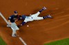 Los Angeles Dodgers right fielder Mookie Betts steals third past Tampa Bay Rays third baseman Joey Wendle during the fifth inning in Game 1 of the baseball World Series Tuesday, Oct. 20, 2020, in Arlington, Texas. (AP Photo/David J. Phillip)