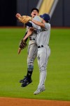 Tampa Bay Rays shortstop Willy Adames and second baseman Brandon Lowe celebrate their win in Game 2 of the baseball World Series against the Los Angeles Dodgers Wednesday, Oct. 21, 2020, in Arlington, Texas. Ray beat the Dodgers 6-4.(AP Photo/Eric Gay)