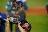 Los Angeles Dodgers pitcher Clayton Kershaw celebrates with the trophy after defeating the Tampa Bay Rays 3-1 to win the baseball World Series in Game 6 Tuesday, Oct. 27, 2020, in Arlington, Texas. (AP Photo/Eric Gay)