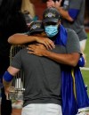 Los Angeles Dodgers third baseman Justin Turner hugs relief pitcher Kenley Jansen after defeating the Tampa Bay Rays 3-1 to win the baseball World Series in Game 6 Tuesday, Oct. 27, 2020, in Arlington, Texas. (AP Photo/Tony Gutierrez)