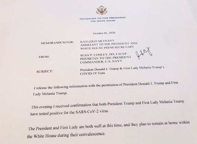 This shows a White House memorandum released Thursday, Oct. 1, 2020 by the Physician to the President, confirming that both President Trump and first lady Melania Trump have tested positive for the SARS-CoV-2 virus. (AP Photo/Wayne Partlow)