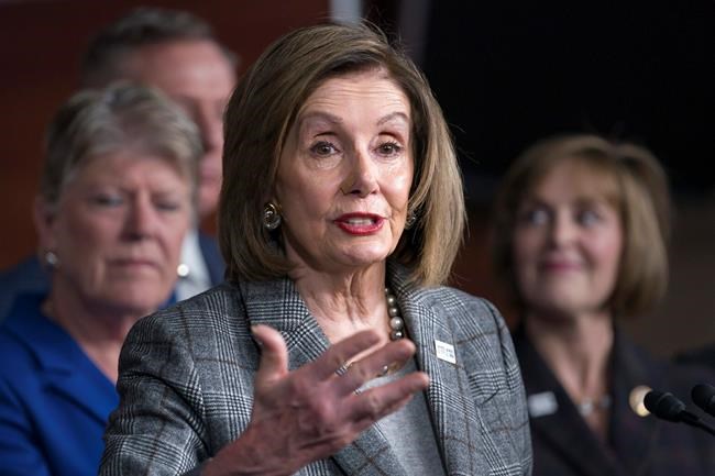 In this Dec. 6, 2019, photo, Speaker of the House Nancy Pelosi, D-Calif., discusses her recent visit to the UN Climate Change Conference in Madrid, Spain, at the Capitol in Washington. Washington's impeachment drama is dominating the news, but key figures on Capitol Hill such as House Speaker Nancy Pelosi also have their day jobs to do. The California Democrat faces a testing time over the next two weeks, toggling between impeachment and ripe legislative issues such as trade, a government-wide funding bill, and the annual defense policy bill. (AP Photo/J. Scott Applewhite)