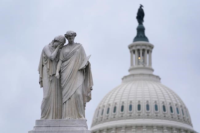 The Peace Monument, also known as the Naval Monument or Civil War Sailors Monument, is framed by the Capitol dome on Capitol Hill in Washington, Monday, Jan. 4, 2021. Wednesday’s congressional joint session to count electoral votes could drag late into the night as some Republicans plan to challenge Democrat Joe Biden’s victory in at least six states. (AP Photo/Susan Walsh)