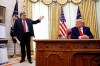 FILE - In this July 15, 2020, file photoAttorney General William Barr, left, speaks with President Donald Trump during a a law enforcement briefing on the MS-13 gang in the Oval Office of the White House in Washington. (AP Photo/Patrick Semansky, File)