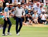 U.S. team player and captain Tiger Woods, right, and playing partner Justin Thomas smile after playing the 4th hole in their foursomes match during the President's Cup golf tournament at Royal Melbourne Golf Club in Melbourne, Friday, Dec. 13, 2019. (AP Photo/Andy Brownbill)