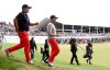 U.S. team player Patrick Reed, left, and playing partner Webb Simpson leave the 13th tee box in their foursome match during the President's Cup golf tournament at Royal Melbourne Golf Club in Melbourne, Saturday, Dec. 14, 2019. (AP Photo/Andy Brownbill)