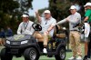 International assistant captain K.J. Choi, left, captain Ernie Els and player Sungjae Im talk during a practice session ahead of the President's Cup Golf tournament in Melbourne, Tuesday, Dec. 10, 2019. (AP Photo/Andy Brownbill)