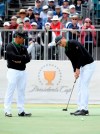 International Assistant captain K.J. Choi, left of South Korea and Haotong Li of China during a practice round ahead of the President's Cup Golf tournament in Melbourne, Wednesday, Dec. 11, 2019. (AP Photo/Andy Brownbill)