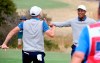 U.S. team player Justin Thomas, left, celebrates with his playing partner and captain, Tiger Woods, on the 18th green in their foursomes match during the President's Cup golf tournament at Royal Melbourne Golf Club in Melbourne, Friday, Dec. 13, 2019. (AP Photo/Andy Brownbill)