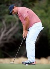 U.S. team player Patrick Reed putts on the 7th green during their fourball match at the Royal Melbourne Golf Club in the opening rounds of the President's Cup golf tournament in Melbourne, Thursday, Dec. 12, 2019. (AP Photo/Andy Brownbill)
