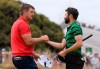 U.S. team player Bryson DeChambeau, left, and International team player Adam Hadwin of Canada shake hands after tying their singles match during the President's Cup golf tournament at Royal Melbourne Golf Club in Melbourne, Sunday, Dec. 15, 2019. (AP Photo/Andy Brownbill)