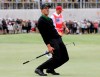 International team player Adam Scott of Australia grimaces after missing a putt on the 16th green in his singles match during the President's Cup golf tournament at Royal Melbourne Golf Club in Melbourne, Sunday, Dec. 15, 2019. (AP Photo/Andy Brownbill)