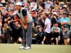 International team player Byeong Hun An of South Korea leans on his putter after missing a putt the 18th green that would have won the their foursome match during the President's Cup golf tournament at Royal Melbourne Golf Club in Melbourne, Saturday, Dec. 14, 2019. (AP Photo/Andy Brownbill)
