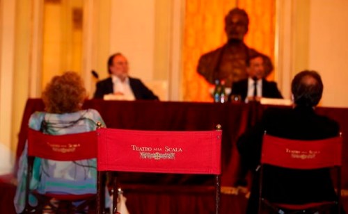 Reporters attend a for press conference to present the fall 2020 program of concerts and ballets, in Milan, Italy, Monday, July 27, 2020. The presentation marks the reopening of one of the world’s most renown theaters following the coronavirus lockdown as well as support of artists who were left without work during the shutdowns.(AP Photo/Antonio Calanni)