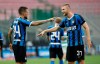 Inter Milan's Cristiano Biraghi, left, celebrates with his teammate Skriniar after scoring his side's second goal during the Serie A soccer match between Inter Milan and Sassuolo at the San Siro Stadium, in Milan, Italy, Wednesday, June 24, 2020. (AP Photo/Luca Bruno)