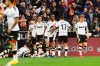 Valencia's Maxi Gomez, bottom, celebrates with his teammates after scoring his side's second goal during the Spanish La Liga soccer match between Valencia and Barcelona at the Mestalla Stadium in Valencia, Spain, Saturday, Jan. 25, 2020. (AP Photo/Alberto Saiz)
