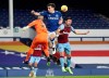 West Ham's goalkeeper Darren Randolph, left, challenges for the ball with Everton's Seamus Coleman during the English Premier League soccer match between Everton and West Ham at Goodison Park in Liverpool, England, Friday, Jan. 1, 2021. (Jan Kruger, Pool via AP)