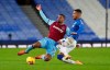 West Ham's Sebastien Haller, left, challenges for the ball with Everton's Mason Holgate during the English Premier League soccer match between Everton and West Ham at Goodison Park in Liverpool, England, Friday, Jan. 1, 2021. (Peter Byrne,Pool via AP)