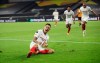 Sevilla's Lucas Ocampos celebrates after scoring his side's opening goal during the Europa League quarterfinal soccer match between Wolves and Sevilla at the MSV Arena in Duisburg, Germany, Tuesday, Aug. 11, 2020. (Friedemann Vogel, Pool Photo via AP)