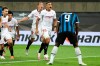 Sevilla's Diego Carlos, second from right, celebrates after scoring his side's third goal as Inter Milan's Romelu Lukaku, right, reacts during the Europa League final soccer match between Sevilla and Inter Milan in Cologne, Germany, Friday, Aug. 21, 2020. (Lars Baron, Pool Photo via AP)