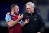 West Ham's manager David Moyes, right, smiles with his player Vladimir Coufal at the end of the English Premier League soccer match between Everton and West Ham at Goodison Park in Liverpool, England, Friday, Jan. 1, 2021. (Alex Pantling, Pool via AP)