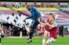 Arsenal's Alexandre Lacazette scores his side's third goal during the English Premier League soccer match between West Ham United and Arsenal at the London Stadium in London, England, Sunday, March 21, 2021. (Justin Tallis, Pool via AP)