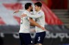 Manchester City's Ruben Dias, left, hugs teammate John Stones at the end of the English Premier League soccer match between Southampton and Manchester City at the St Mary's Stadium, in Southampton, Saturday, Dec. 19, 2020. (Adrian Dennis/Pool via AP)