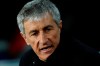 Barcelona's head coach Quique Setien sits on the bench during a Spanish La Liga soccer match between Barcelona and Granada at Camp Nou stadium in Barcelona, Spain, Sunday, Jan. 19, 2020. (AP Photo/Joan Monfort)