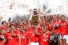 FILE - In this May 18, 2019 file photo, Benfica's team captain Jardel lifts the trophy after Benfica won the Portuguese league by beating Santa Clara in the last round soccer match at the Luz stadium in Lisbon. The Portuguese league will resume Wednesday, June 4, 2020 as European soccer continues to make its gradual return amid the coronavirus pandemic. (AP Photo/Armando Franca, File)
