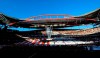 FILE - In this May 24, 2014 file photo, an image of the Champions League trophy is suspended from the roof of the stadium, ahead of the Champions League final soccer match between Atletico Madrid and Real Madrid, at the Luz stadium, in Lisbon, Portugal. UEFA announced Wednesday, June 17, 2020, that the Champions League will finish with a 12-day mini-tournament in Lisbon in August with the final match at the Luz stadium on Aug. 23. (AP Photo/Manu Fernandez)