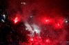 Fans light flares at the start of the League One soccer match between Paris Saint Germain and Lyon at the Parc des Princes stadium in Paris, Sunday, Feb. 9, 2020. (AP Photo/Thibault Camus)