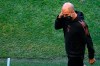 Manchester City's head coach Pep Guardiola walks on the pitch of the Jose Alvalade stadium in Lisbon, Friday Aug. 14, 2020. Manchester City will play Lyon in a Champions League quarterfinals soccer match on Saturday. (Franck Fife/Pool via AP)
